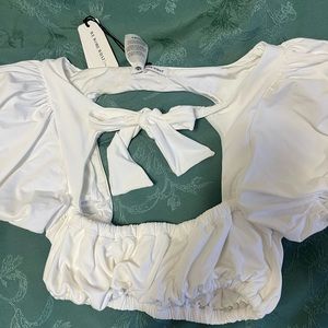 We wore what white swimwear/croptop with pussybow
